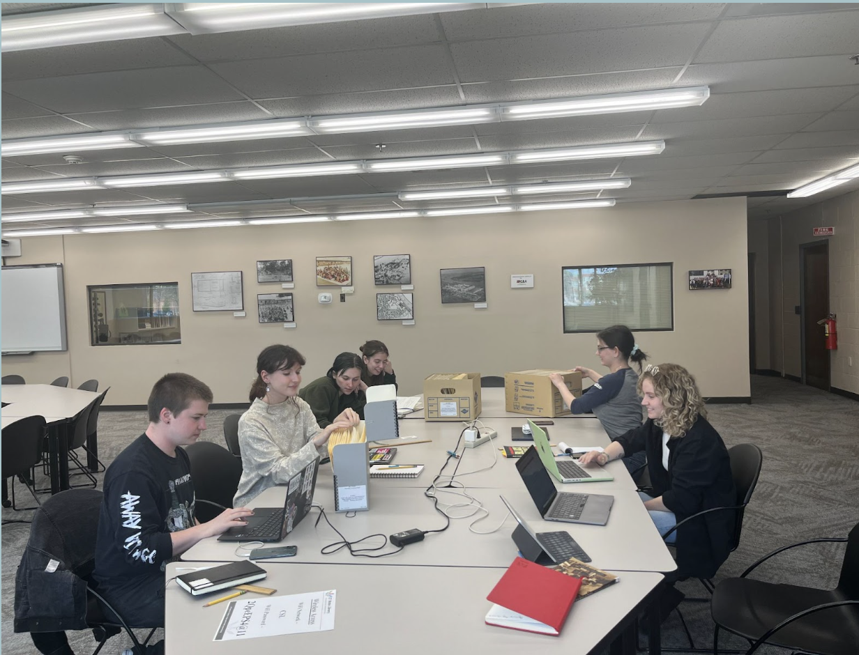 Group working on uncovering and examining Mansfield Training School documents
